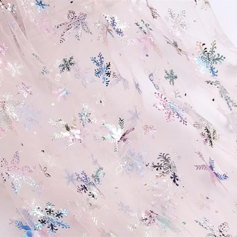 100% Polyester Swissnet Iridescent Foil Snowflake Tulle Fabric