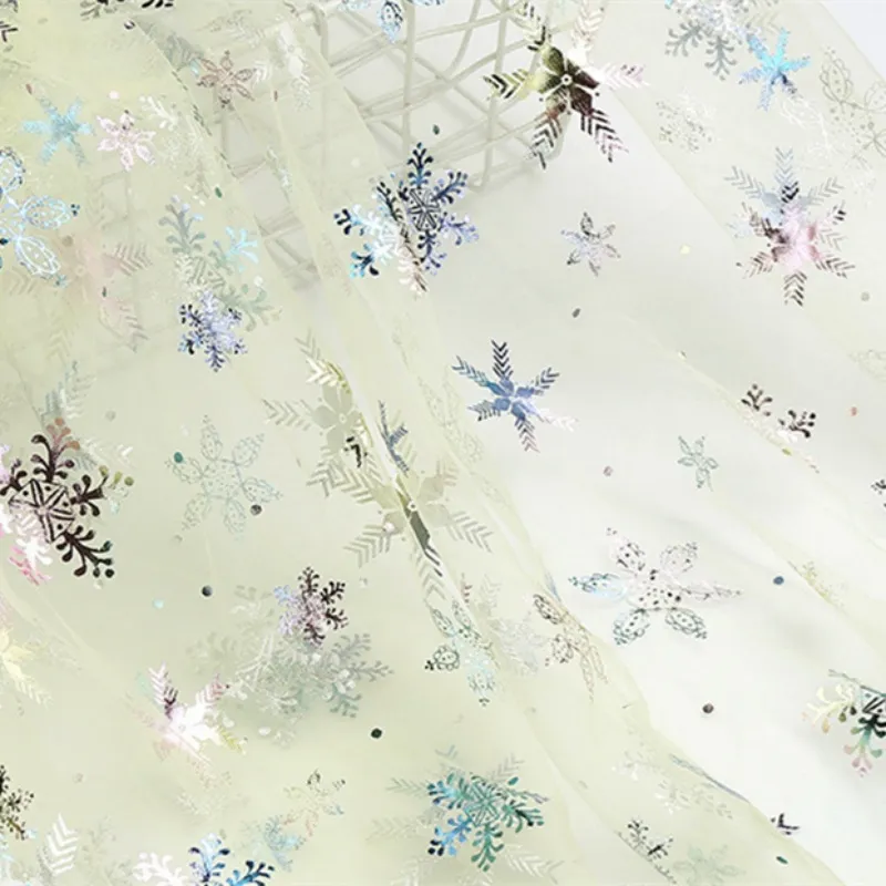 100% Polyester Swissnet Iridescent Foil Snowflake Tulle Fabric